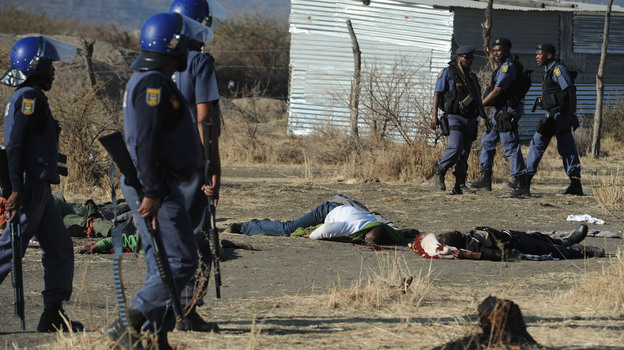 Police surround miners killed in Marikana, South Africa, on Thursday. (AFP/Getty Images)