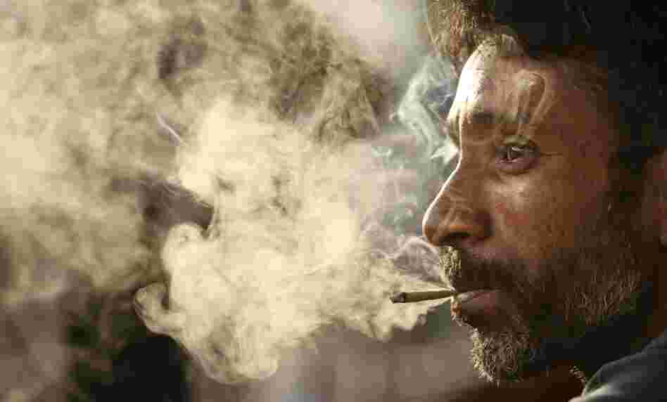 A man smokes a bidi on "No Tobacco Day," May 31, in Allahabad, India. These small, hand-rolled cigarettes are popular in India and Bangladesh because they are far cheaper than regular cigarettes. A man smokes a bidi on "No Tobacco Day," May 31, in Allahabad, India. These small, hand-rolled cigarettes are popular in India and Bangladesh because they are far cheaper than regular cigarettes.