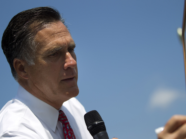 Republican presidential candidate Mitt Romney writes on a whiteboard during a news conference Thursday in Greer, S.C.