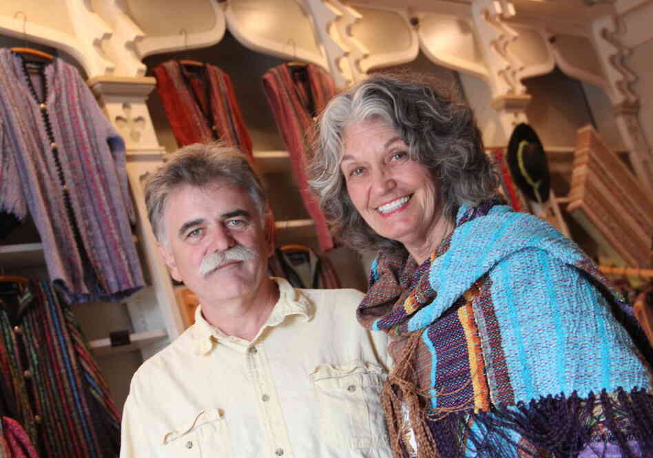 Steve Ayers, a local potter, was part of the effort 14 years ago to recruit other artists to live in Hannibal. He's shown here with Nancy Kaufman, in her shop on Main Street. Kaufman moved to Hannibal in 2005, and says as soon as she saw this old drugstore, she dreamed of turning it into a shop for her woven art.