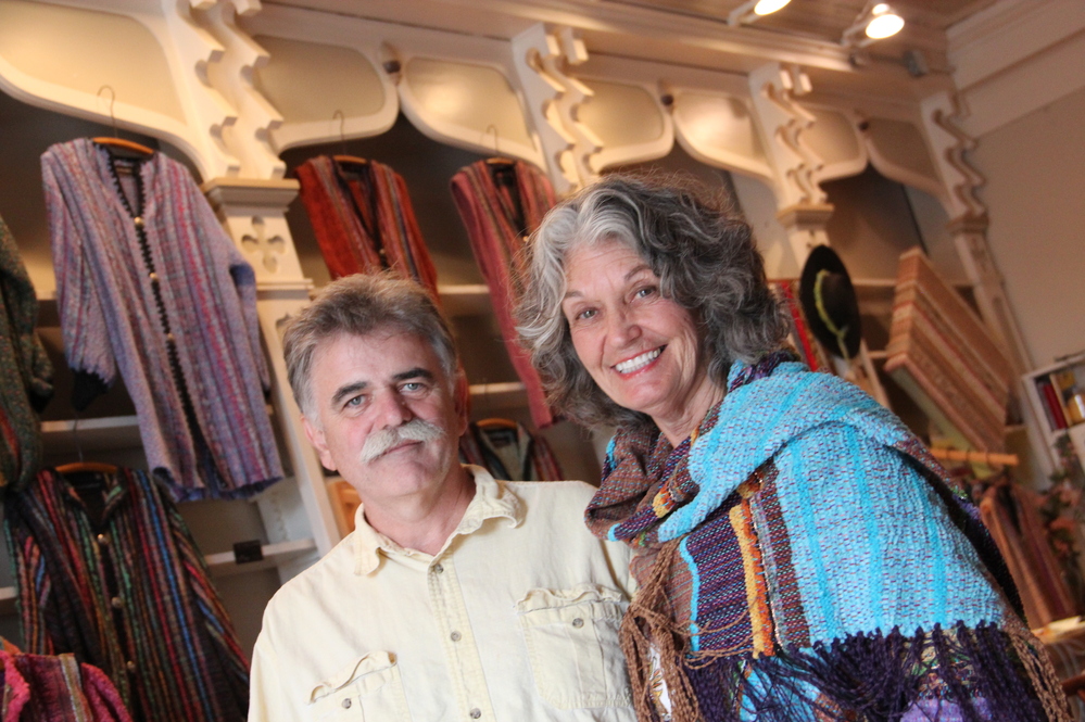 Steve Ayers, a local potter, was part of the effort 14 years ago to recruit other artists to live in Hannibal. He's shown here with Nancy Kaufman, in her shop on Main Street. Kaufman moved to Hannibal in 2005, and says as soon as she saw this old drugstore, she dreamed of turning it into a shop for her woven art.