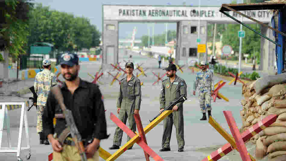 Pakistani Air Force personnel guard an air base northwest of Islamabad earlier today. It was attacked Thursday by militants armed with guns, rocket launchers and suicide vests.