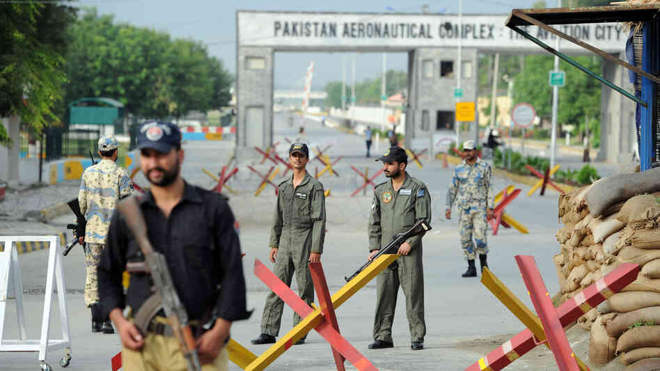 Pakistani Air Force personnel guard an air base northwest of Islamabad earlier today. It was attacked Thursday by militants armed with guns, rocket launchers and suicide vests.