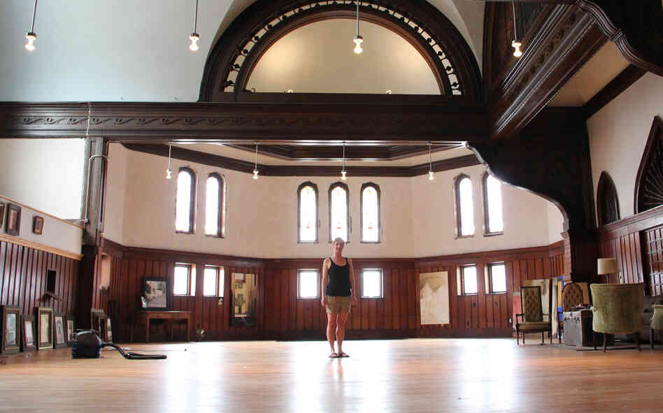 Painter Melissa Dominiak moved here from Seattle and purchased a massive church and home about two miles from Main Street in Hannibal, Mo., for $70,000. She plans to rehab the building herself and rent out the space for special events.