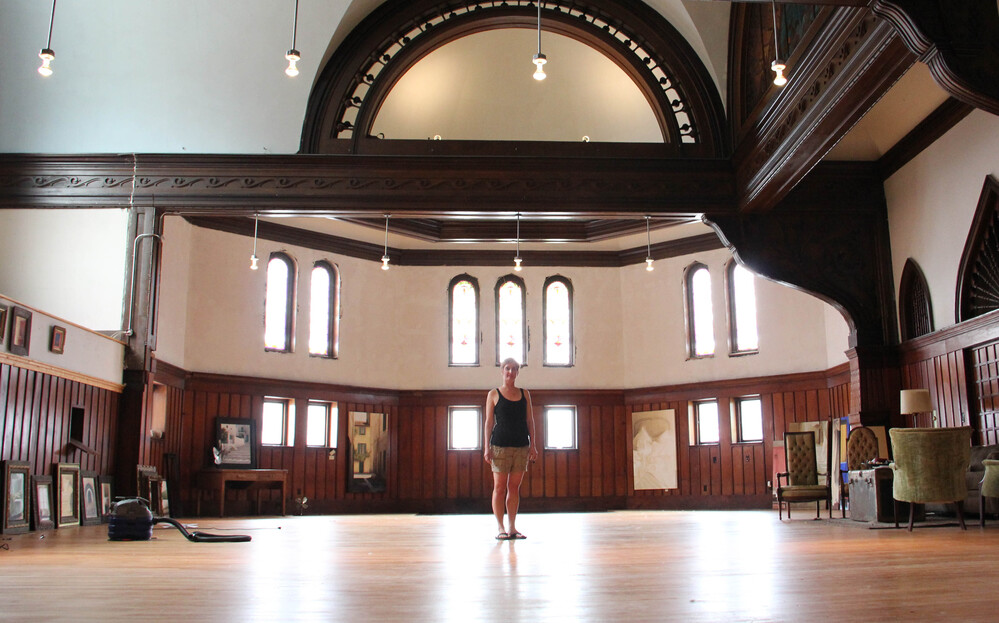 Painter Melissa Dominiak moved here from Seattle and purchased a massive church and home about two miles from Main Street in Hannibal, Mo., for $70,000. She plans to rehab the building herself and rent out the space for special events.