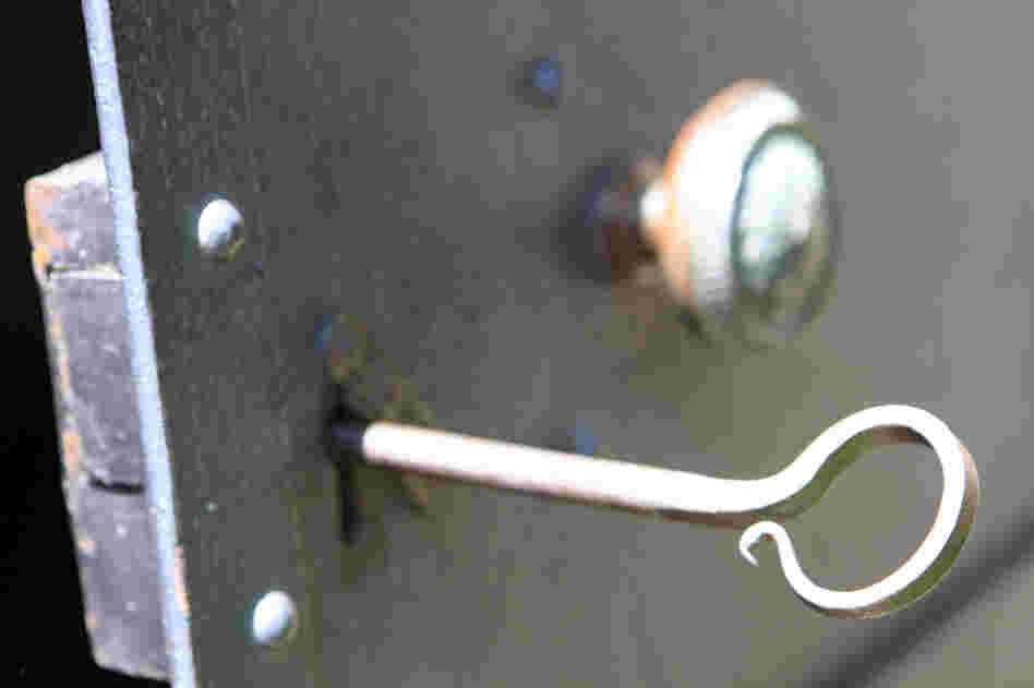 An old iron key unlocks the public vault on the cemetery grounds. 