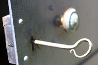 An old iron key unlocks the public vault on the cemetery grounds.