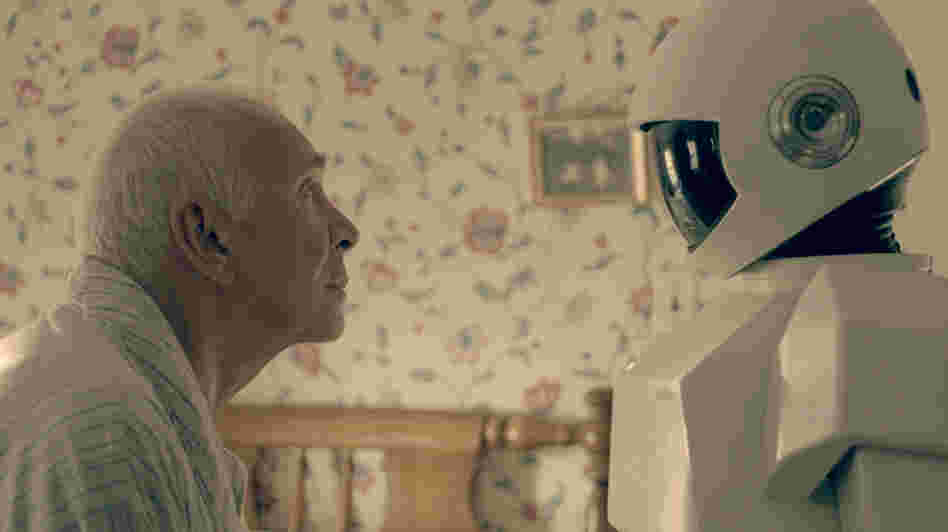 In Robot & Frank, a robot cares for an aging ex-burglar who has dementia. Frank Langella, who plays the burglar, says his character "becomes fond of the robot only because it is a tool for his wicked, wicked ways." In Robot & Frank, a robot cares for an aging ex-burglar who has dementia. Frank Langella, who plays the burglar, says his character "becomes fond of the robot only because it is a tool for his wicked, wicked ways."