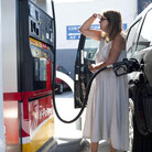 Teresa Jones tanks up in Los Angeles. The high price of crude oil, combined with refinery problems in California and the Midwest, have helped drive up the price of gas nationwide.