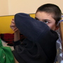 A disabled and orphaned Romanian child in his bed at the Targu Jiu orphanage in southwestern Romania in 2009. Romania has, in general, improved conditions in orphanages that provoked outrage when they were exposed internationally nearly a quarter-century ago. However, some 70,000 kids are still in the care of the state.