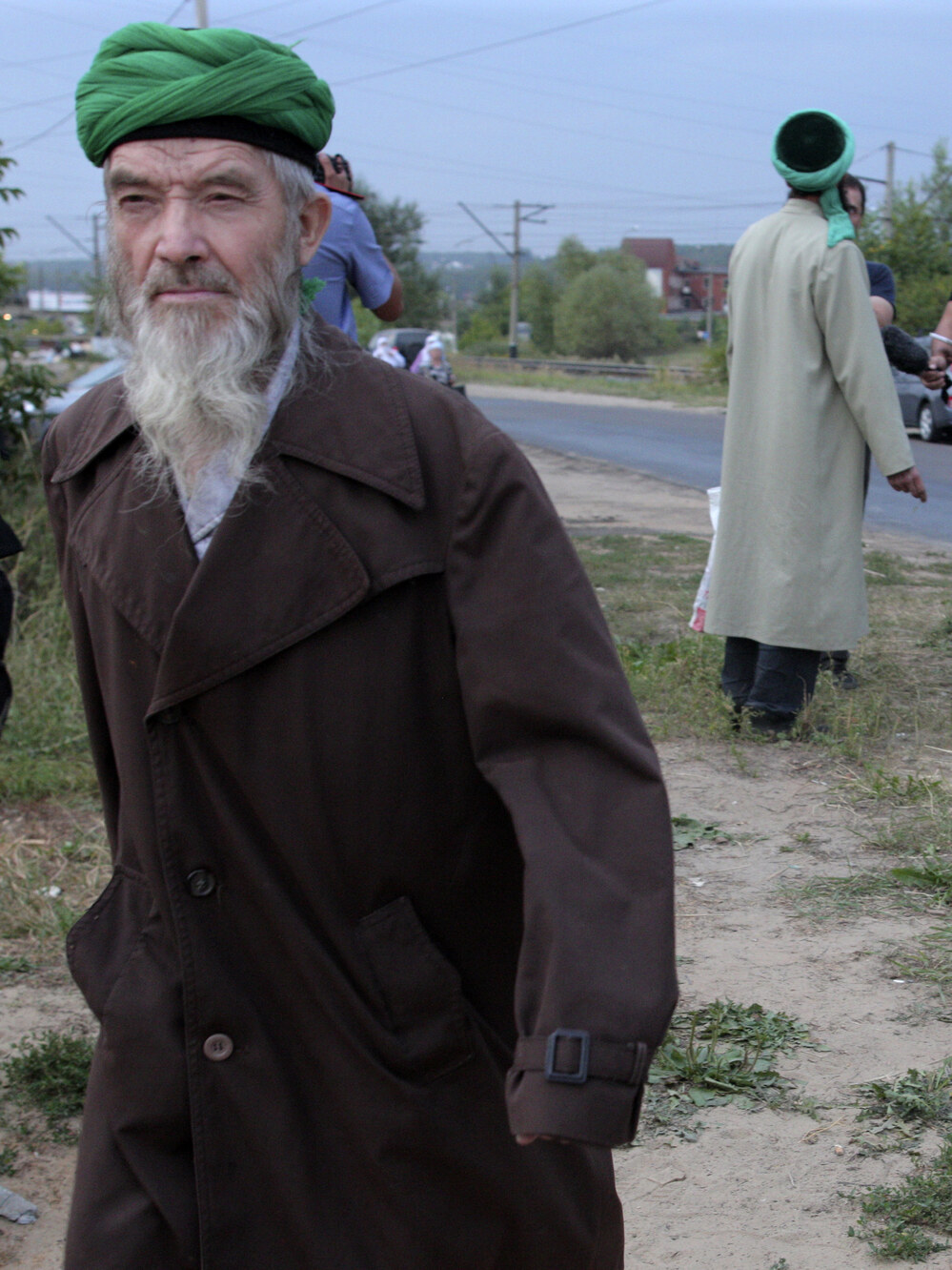 Self-proclaimed "messenger of God" Faizrakhman Satarov approaches the Kazan house earlier this month. The sect's founder says he had a revelation from God that true Muslims must separate themselves from society.