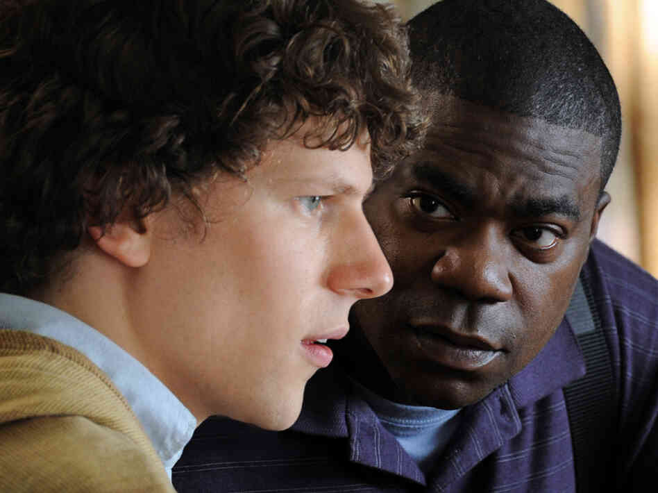 Sprinkles (Tracy Morgan) encourages Eli (Jesse Eisenberg) to shrug off the burden of his troubled family and pursue his talents as a pianist.