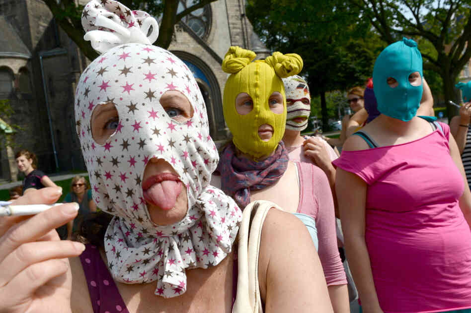 Masked supporters of Pussy Riot gather in Hamburg, Germany.