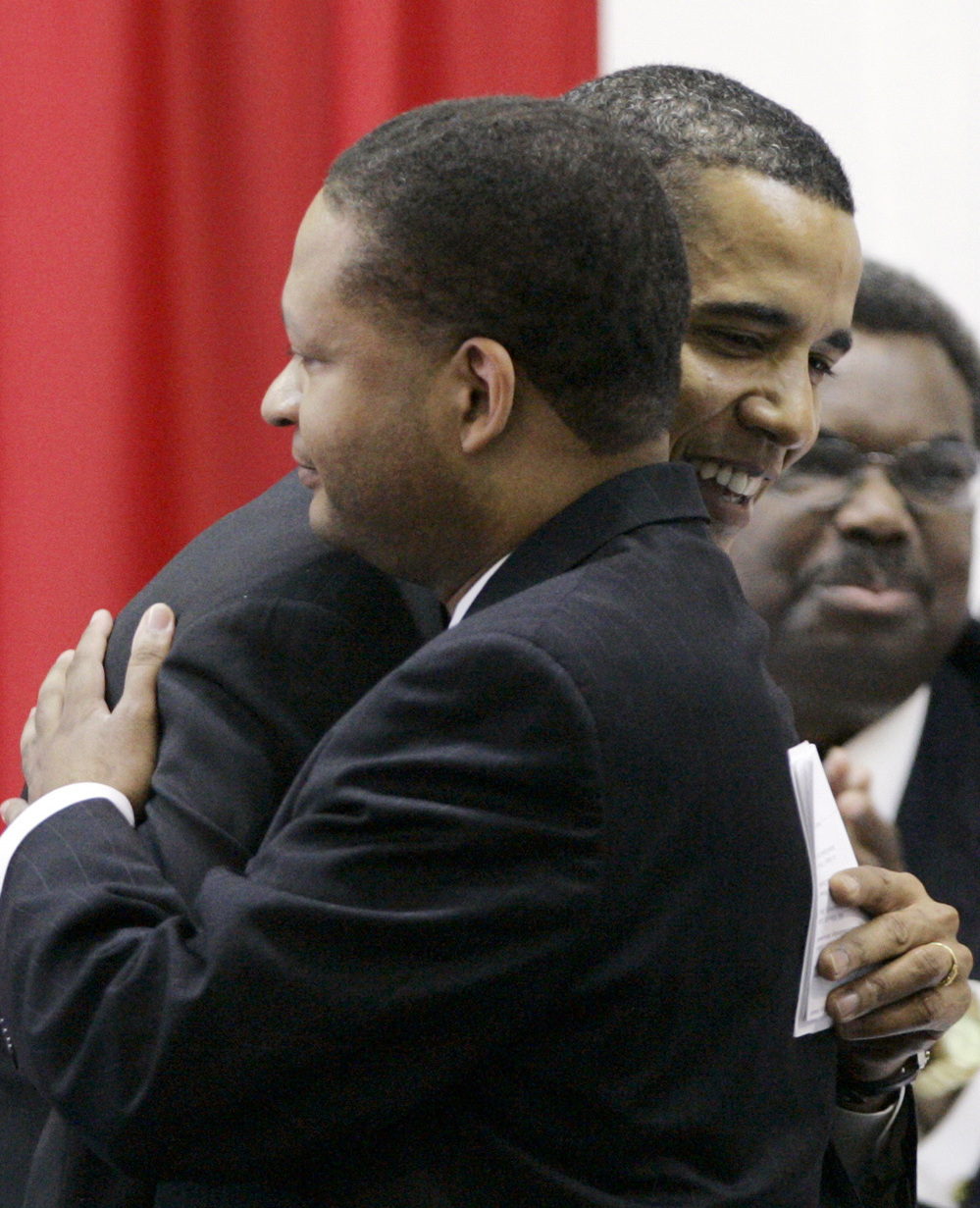 Barack Obama, then a Democratic candidate for president, hugs former U.S. Rep. Artur Davis, in Selma, Ala., in 2007.