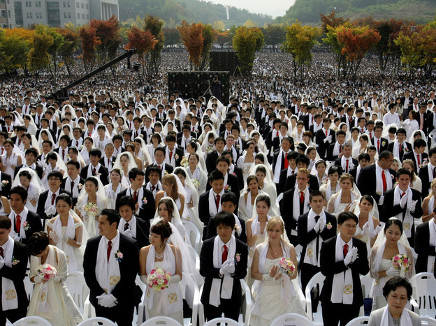 Couples from around the world participate in a mass wedding ceremony arranged by the Rev. Sun Myung Moon's Unification Church in South Korea in 2009.
