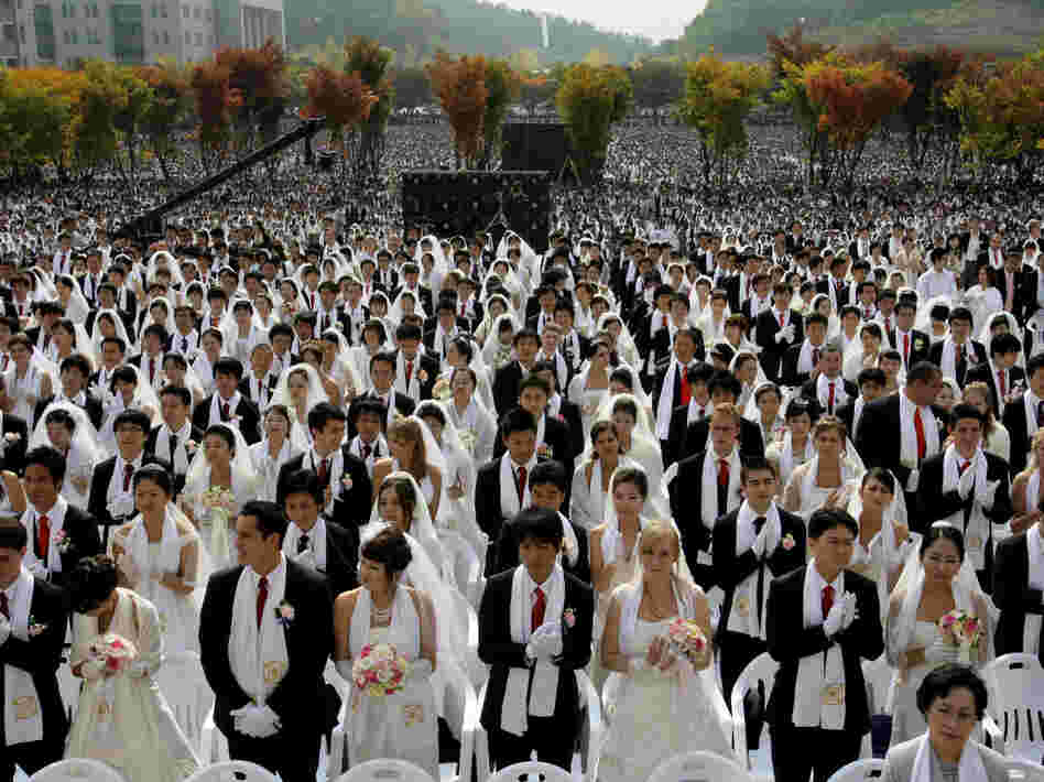 Couples from around the world participate in a mass wedding ceremony arranged by the Rev. Sun Myung Moon's Unification Church in South Korea in 2009.