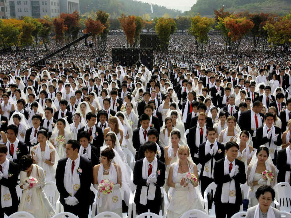 Couples from around the world participate in a mass wedding ceremony arranged by the Rev. Sun Myung Moon's Unification Church in South Korea in 2009.