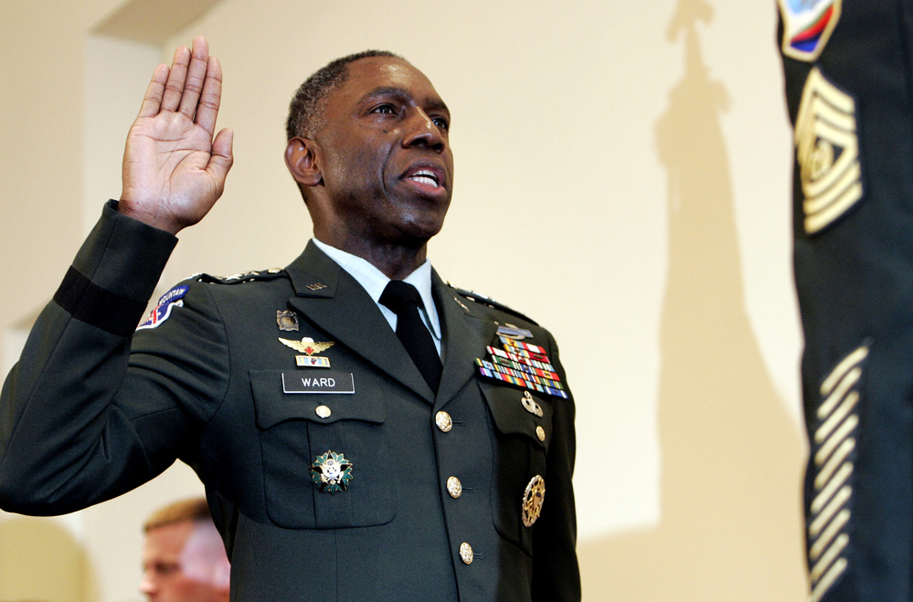 Army Lt. Gen. William E. Kip Ward is adminstered the oath of four-star General, the Army's highest rank of general.