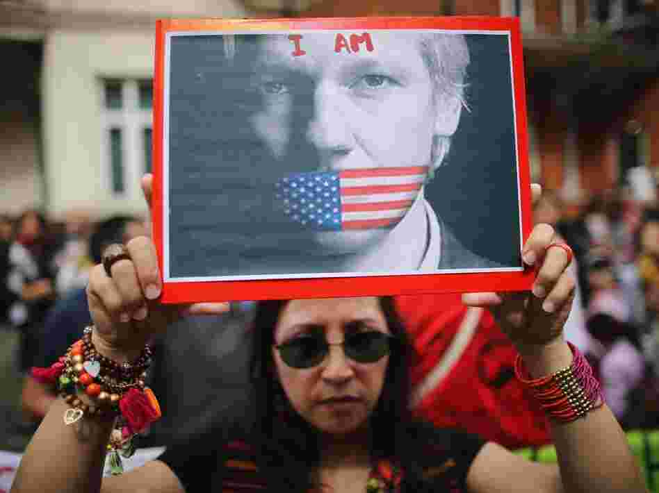 Protesters gather outside the Ecuadorian Embassy, where Wikileaks founder Julian Assange is staying, on August 16 in London, England. Assange has been living inside the embassy since June 19 to avoid extradition to Sweden to face allegations of sexual assault.
