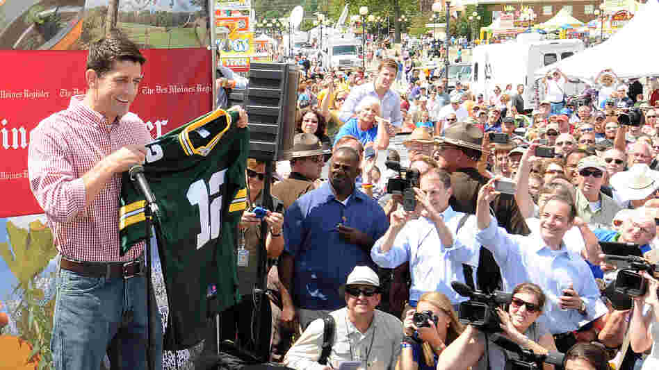 Republican vice presidential candidate Paul Ryan holds up a Green Bay Packers jersey during a campaign stop at the Iowa State Fair.