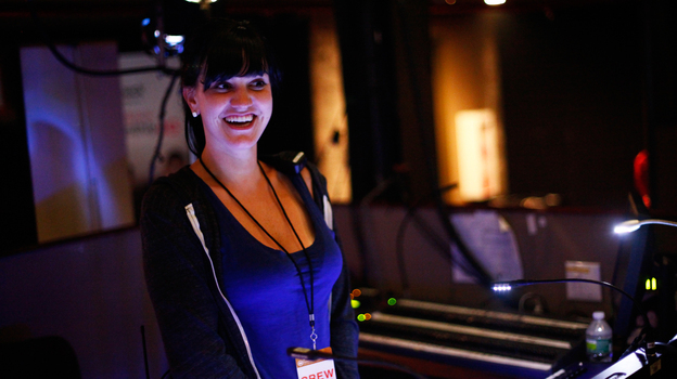 Lighting director Jackie Finney runs the light show during concerts for the band fun. (NPR)