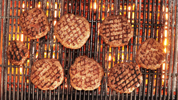 The author's venison burgers, fired up on the grill.