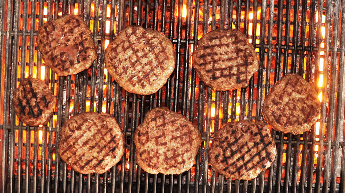 The author's venison burgers, fired up on the grill.