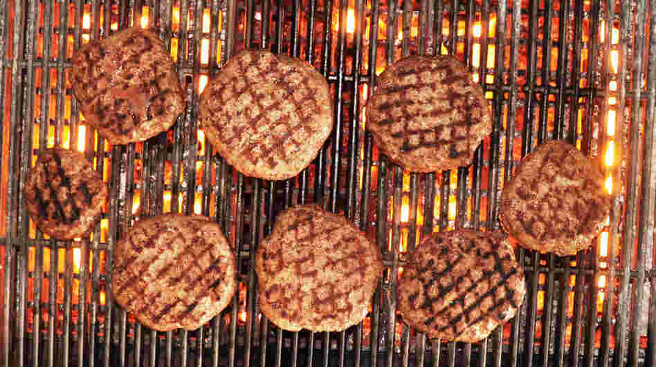 The author's venison burgers, fired up on the grill.
