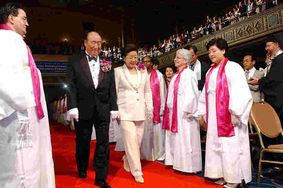 Moon and his wife are introduced during the Affirmation of Vows part of the Interreligious and International Couple's Blessing and Rededication Ceremony, 2002, at New York's Manhattan Center. Some 500 to 600 couples participated in the New York ceremony, and an estimated 21 million couples participated worldwide via a simulcast to 185 countries.