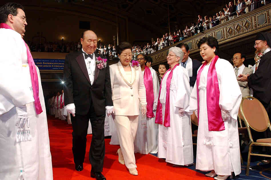 Moon and his wife are introduced during the Affirmation of Vows part of the Interreligious and International Couple's Blessing and Rededication Ceremony, 2002, at New York's Manhattan Center. Some 500 to 600 couples participated in the New York ceremony, and an estimated 21 million couples participated worldwide via a simulcast to 185 countries.