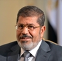 Egypt's new president, Mohammed Morsi, has promised to improve the lives of ordinary Egyptians during his first 100 days in office. But Morsi, shown here in July, is dealing with multiple challenges, including an economy that has been struggling since last year's revolution.