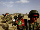 Afghan soldiers (right) patrol with U.S. troops in the Panjwai district of southern Afghanistan in May. The two armies have been working together for years, but Afghan attacks against U.S. and NATO forces have been rising recently. Afghan soldiers (right) patrol with U.S. troops in the Panjwai district of southern Afghanistan in May. The two armies have been working together for years, but Afghan attacks against U.S. and NATO forces have been rising recently.