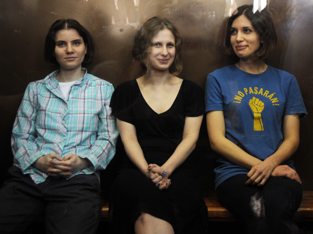 Members of the all-girl punk band Pussy Riot: Nadezhda Tolokonnikova (right), Maria Alyokhina (center) and Yekaterina Samutsevich (left) in a glass-walled cage during a court hearing in Moscow earlier today.
