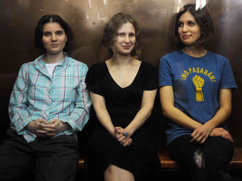 Members of the all-girl punk band Pussy Riot: Nadezhda Tolokonnikova (right), Maria Alyokhina (center) and Yekaterina Samutsevich (left) in a glass-walled cage during a court hearing in Moscow earlier today.