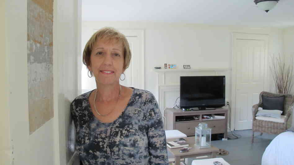Eva Boice moved to Strawbery Banke from New York to be closer to her family. A retired social studies teacher, she appreciates the nuances of her new home, like the mismatched paint on her door panel. During renovations, contractors uncovered paint layers dating to the early 1800s.