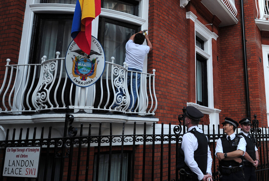 Police stand by near a balcony of the Ecuadorian embassy in London on Sunday.