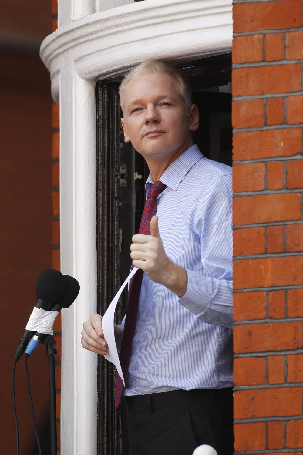 Julian Assange, founder of WikiLeaks, makes a statement from a balcony of the Ecuadorian embassy in London on Sunday.