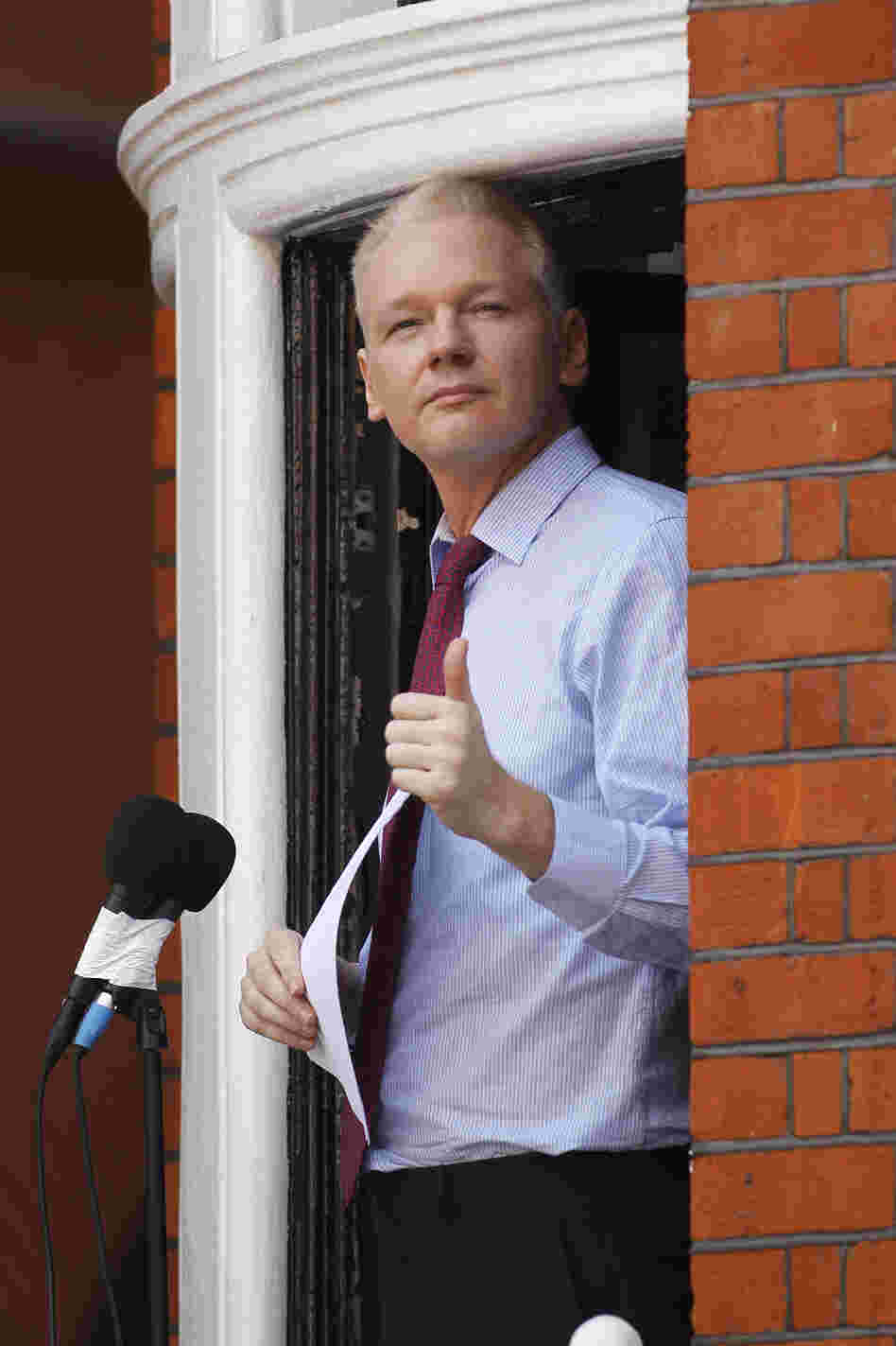 Julian Assange, founder of WikiLeaks, makes a statement from a balcony of the Ecuadorian embassy in London on Sunday.