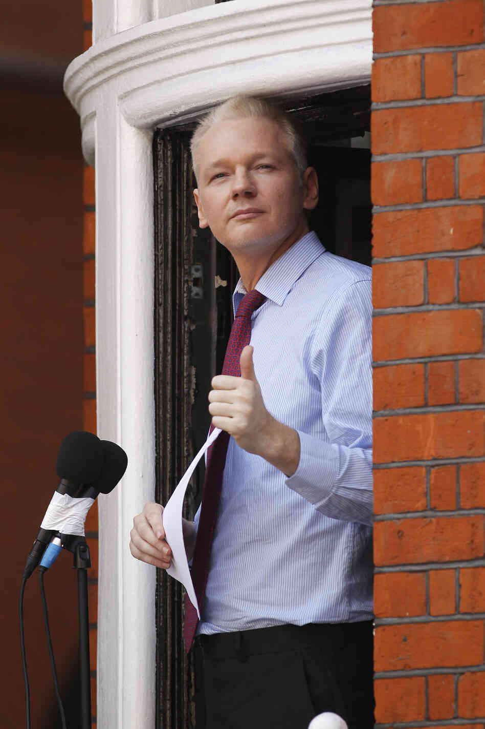 Julian Assange, founder of WikiLeaks, makes a statement from a balcony of the Ecuadorian embassy in London on Sunday.
