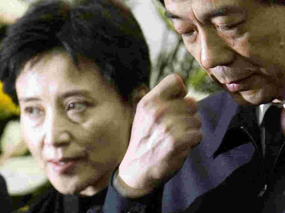 In this Jan. 17, 2007, photo, Gu Kailai, left, and her husband, Bo Xilai, attend a memorial ceremony for Bo's father. Gu was given a suspended death sentence Monday after confessing to killing a British businessman by poisoning him with cyanide.