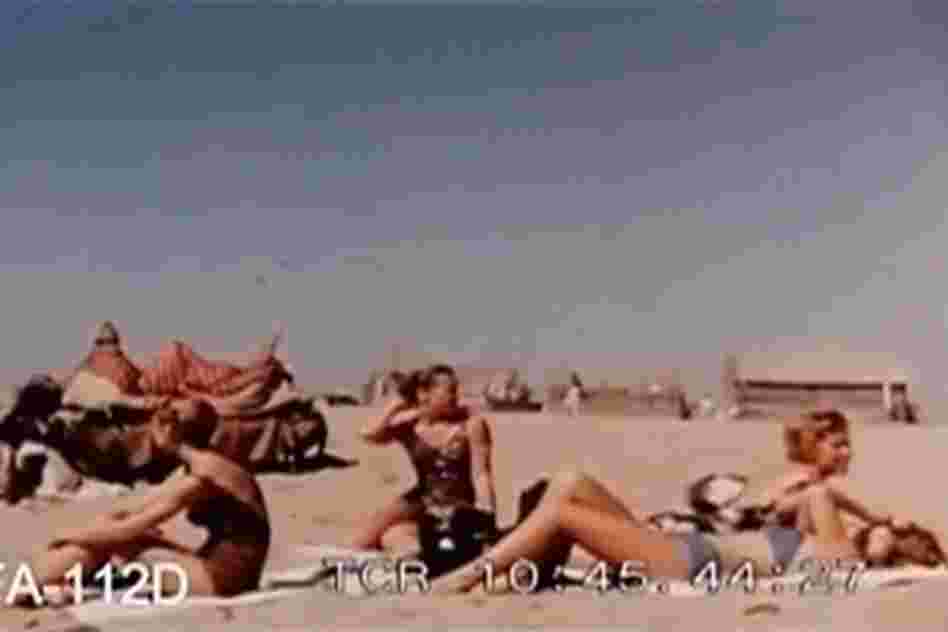 Western tourists sunbathe on a Karachi beach in the early 1960s.