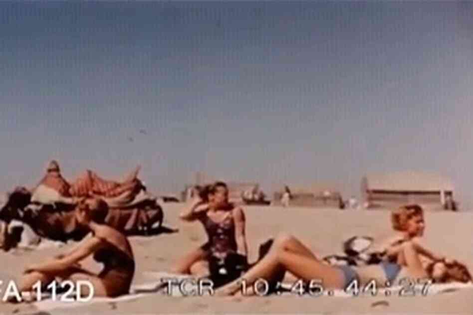 Western tourists sunbathe on a Karachi beach in the early 1960s.