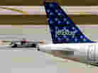 A JetBlue Airways aircraft. A JetBlue Airways aircraft.