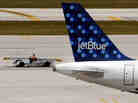A JetBlue Airways aircraft. A JetBlue Airways aircraft.