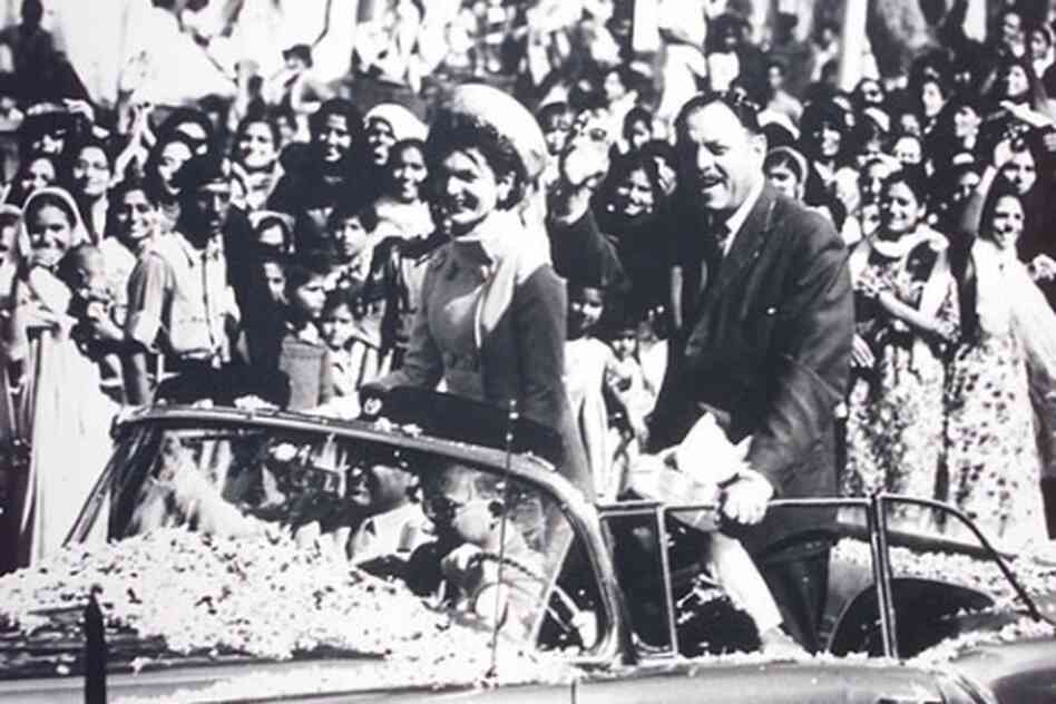 Then-first lady Jacqueline Kennedy visited Pakistan in 1962. Here she is seen riding in a convertible with the then-ruler of Pakistan, Ayub Khan, through throngs of people in Karachi.