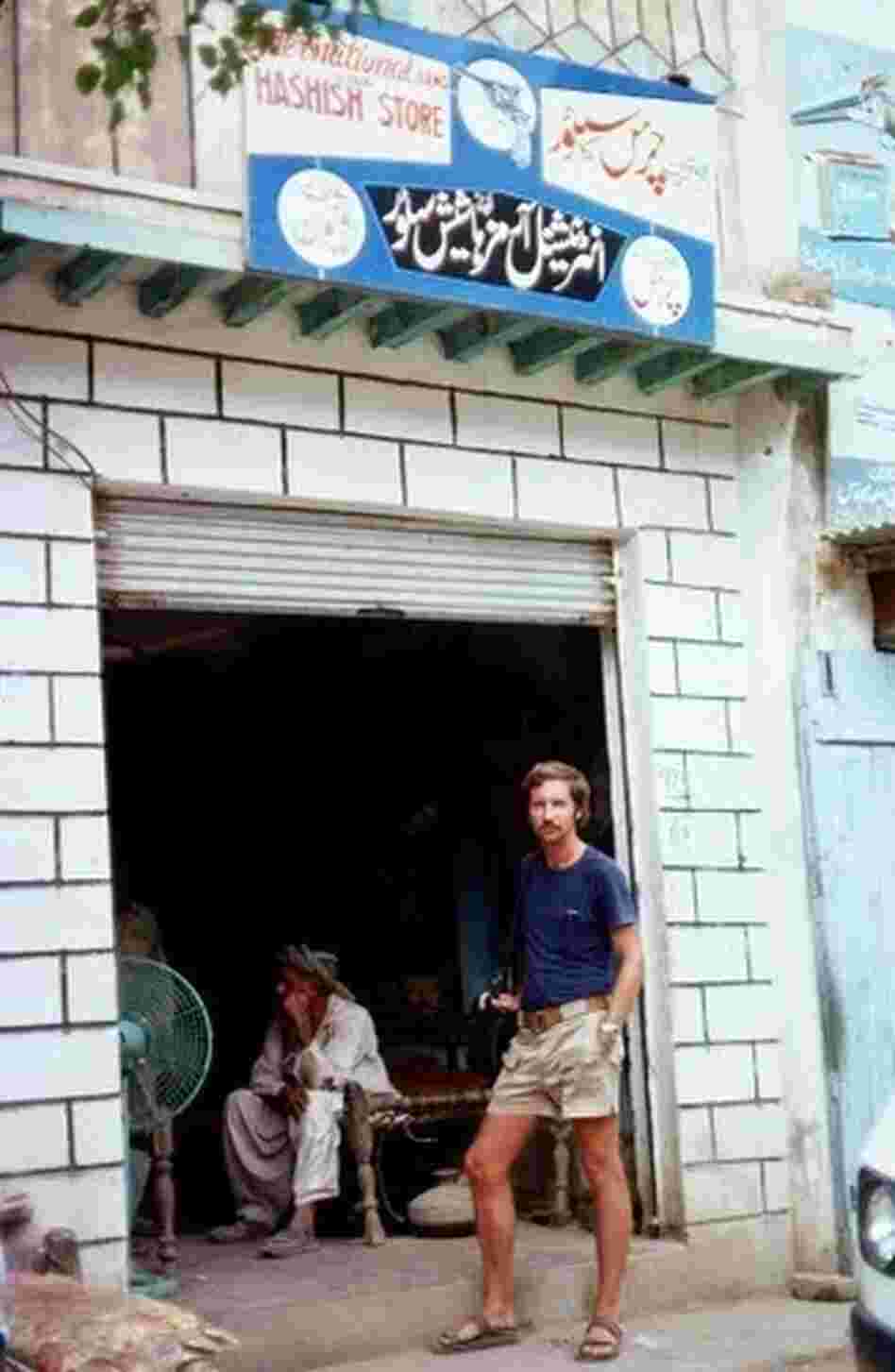 A German tourist stands outside a hashish shop in 1976. Shops selling hashish sprang up in northwestern Pakistan when young Western tourists began to pour in from Afghanistan in the late 1960s.