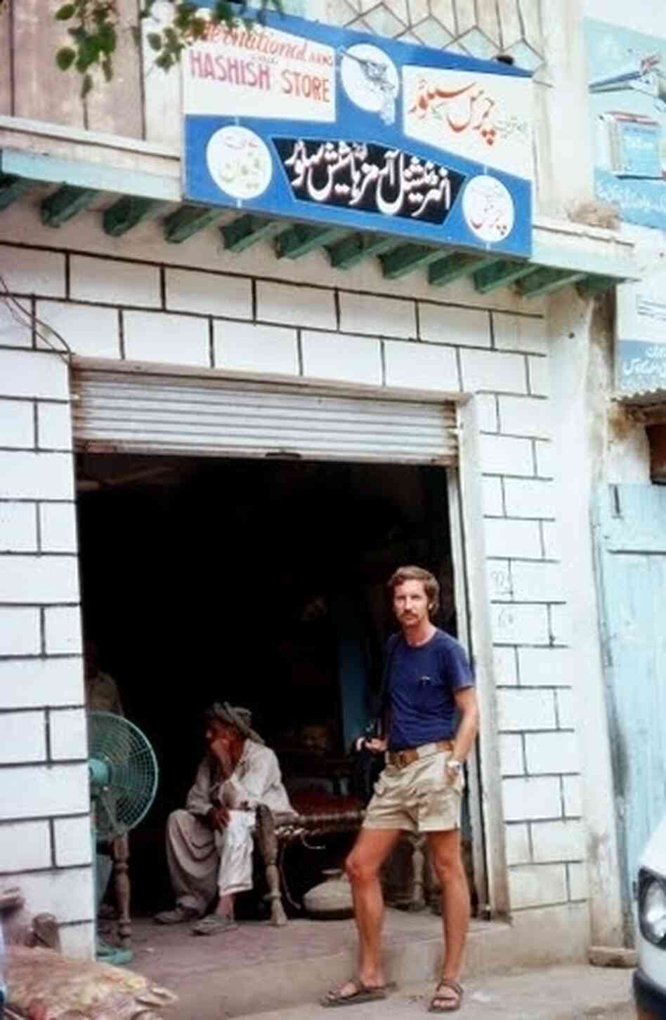 A German tourist stands outside a hashish shop in 1976. Shops selling hashish sprang up in northwestern Pakistan when young Western tourists began to pour in from Afghanistan in the late 1960s.