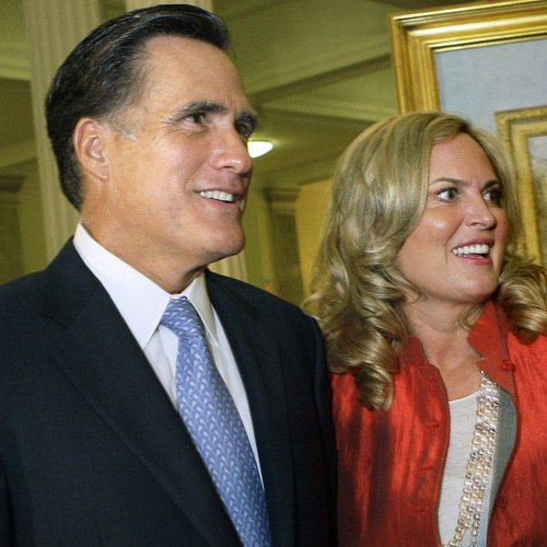 Former Massachusetts Gov. Mitt Romney and his wife, Ann, greet guests after his official portrait is unveiled in 2009 during a ceremony on the Grand Staircase at the Statehouse in Boston.