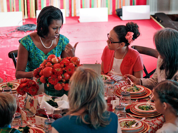 First Lady Michelle Obama chats with Illana Gonzales-Evans from Washington at the first Kids State Dinner.