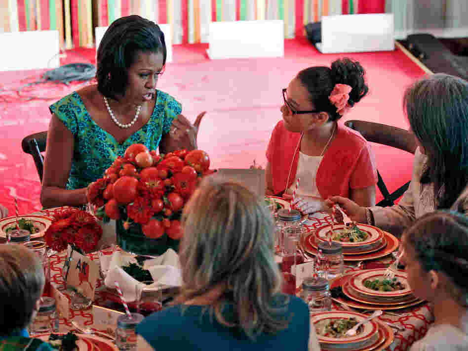First Lady Michelle Obama chats with Illana Gonzales-Evans from Washington at the first Kids State Dinner.